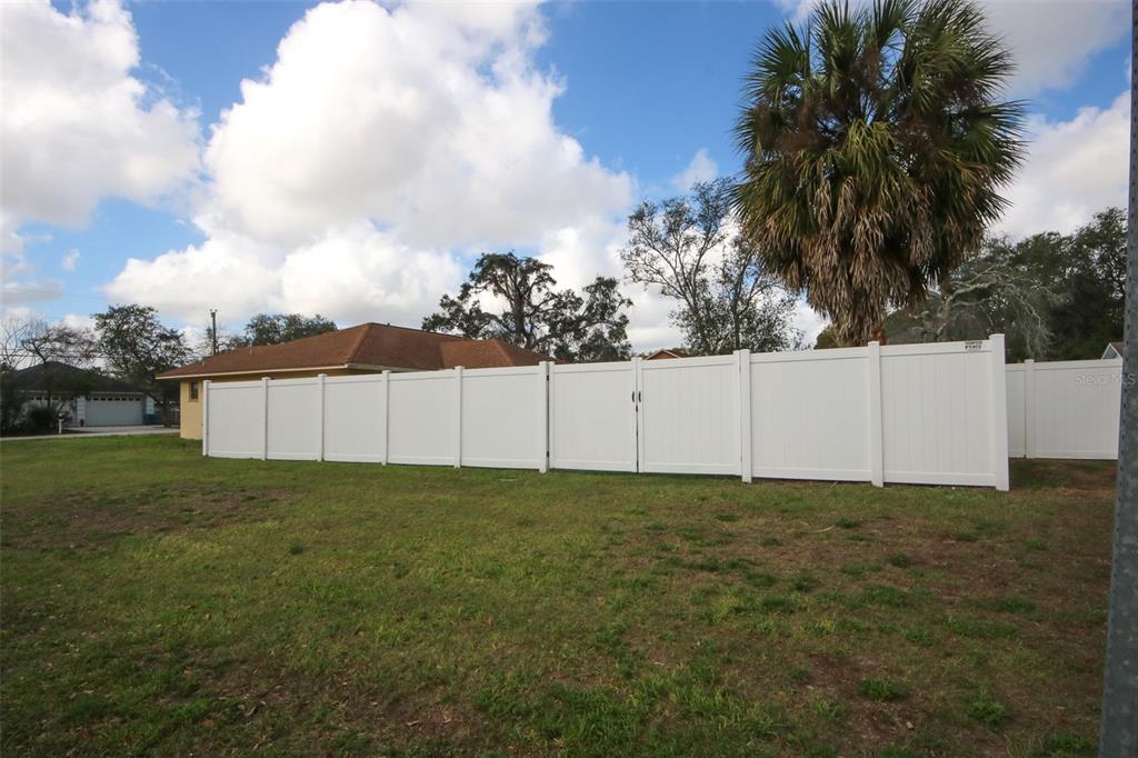 9297 Pickens Street Spring Hill, FL 34608 - Photo 9 of 40 a view of a green field