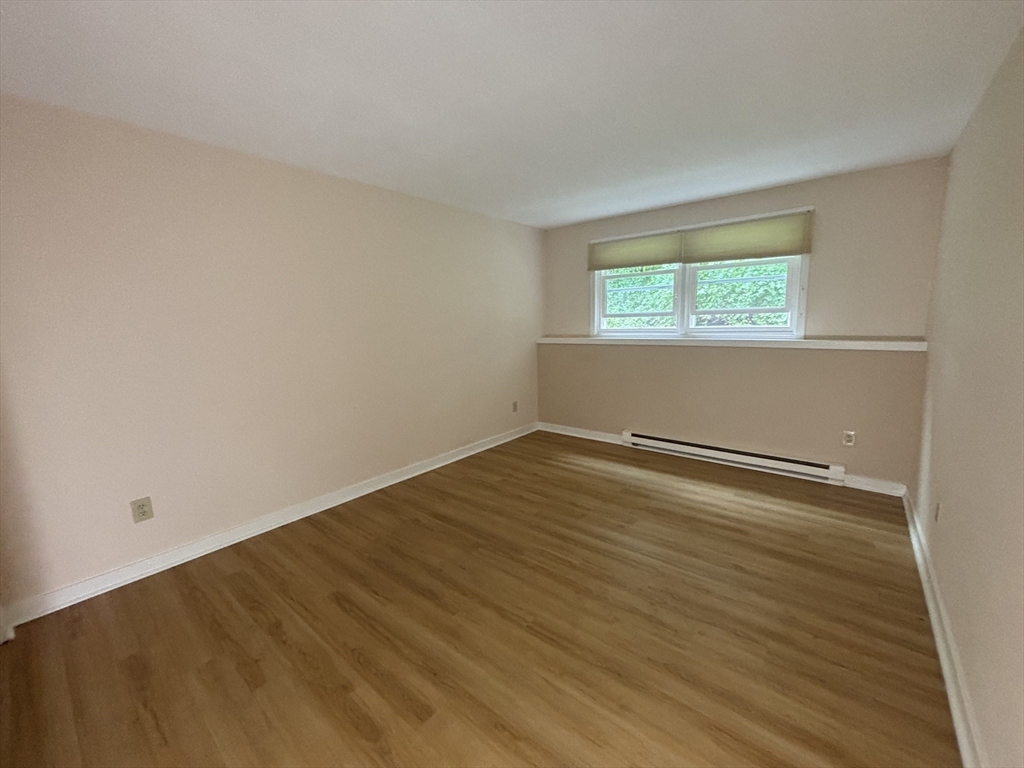 44 Evergreen Road, Unit 102 Leeds, MA 01053 - Photo 11 of 15 wooden floor in an empty room