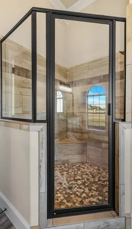 a bathroom with a bathtub and shower