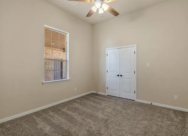 a bathroom with a granite countertop sink a toilet and bathtub
