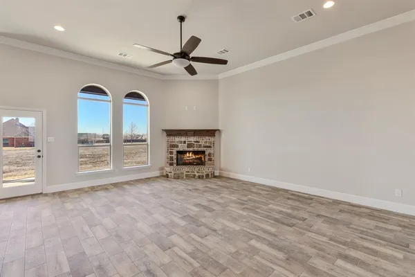 a view of an empty room with a window