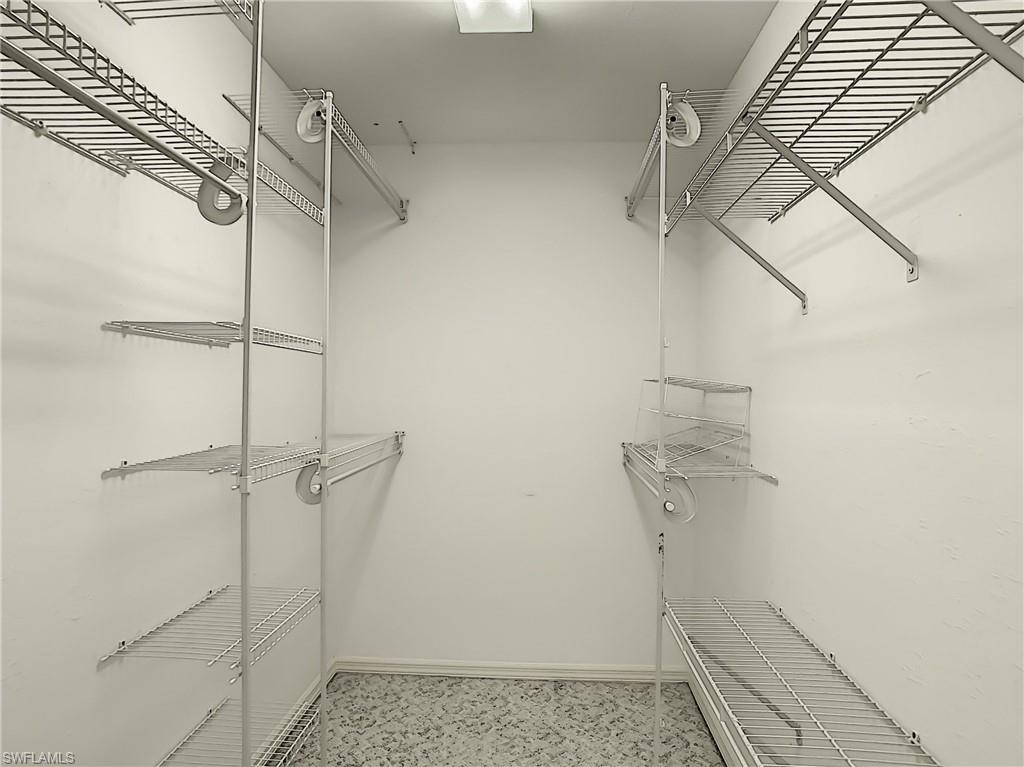 200 Napa Ridge Road East, Unit 6 Naples, FL 34119 - Photo 25 of 28 a view of walk in closet