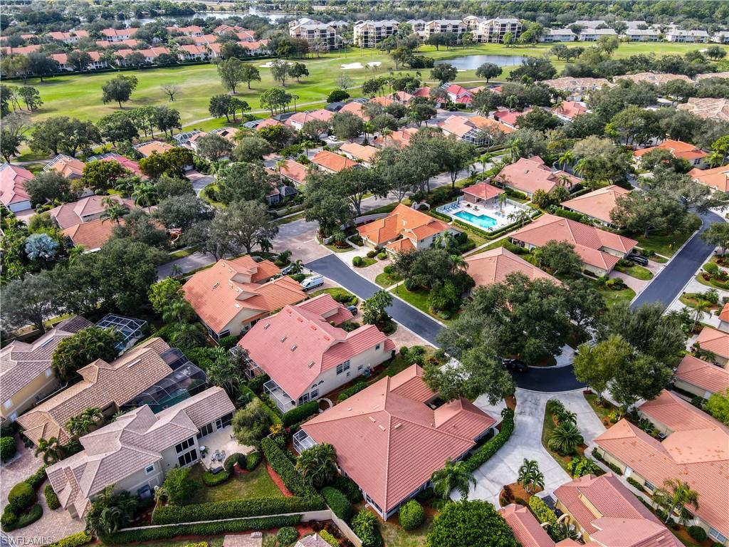 200 Napa Ridge Road East, Unit 6 Naples, FL 34119 - Photo 3 of 28 an aerial view of residential houses with outdoor space and street view