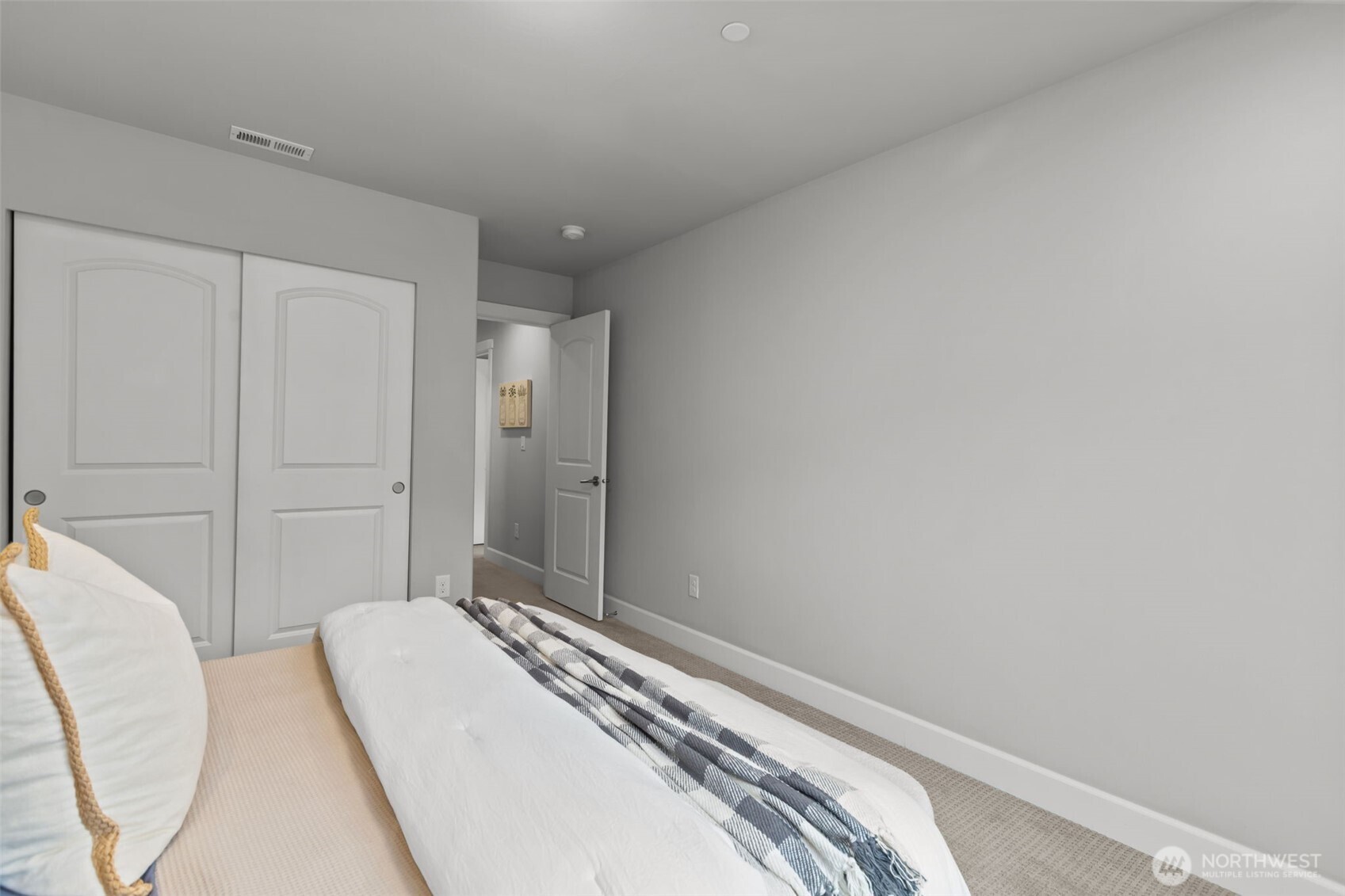 18231 3rd Drive Southeast Bothell, WA 98012 - Photo 23 of 40 a bedroom with a bed and a mirror