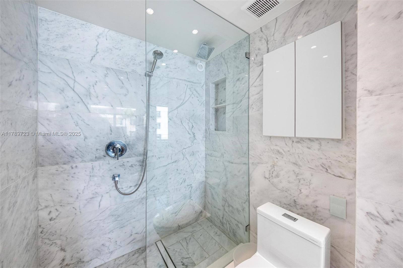 3 Island Avenue, Unit 3C Miami Beach, FL 33139 - Photo 18 of 73 a bathroom with a shower and toilet