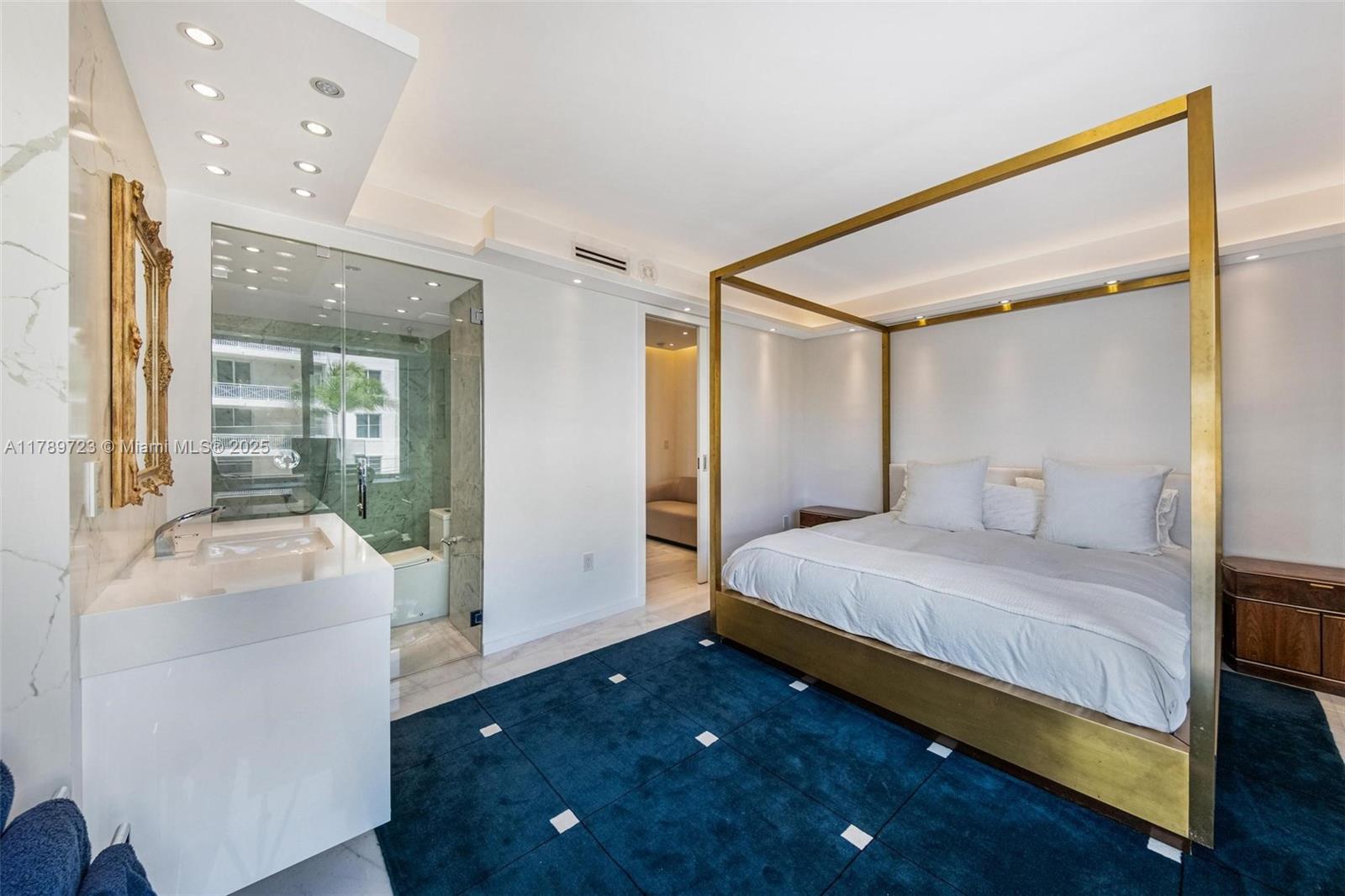 3 Island Avenue, Unit 3C Miami Beach, FL 33139 - Photo 19 of 73 a bedroom with a bed and a large mirror