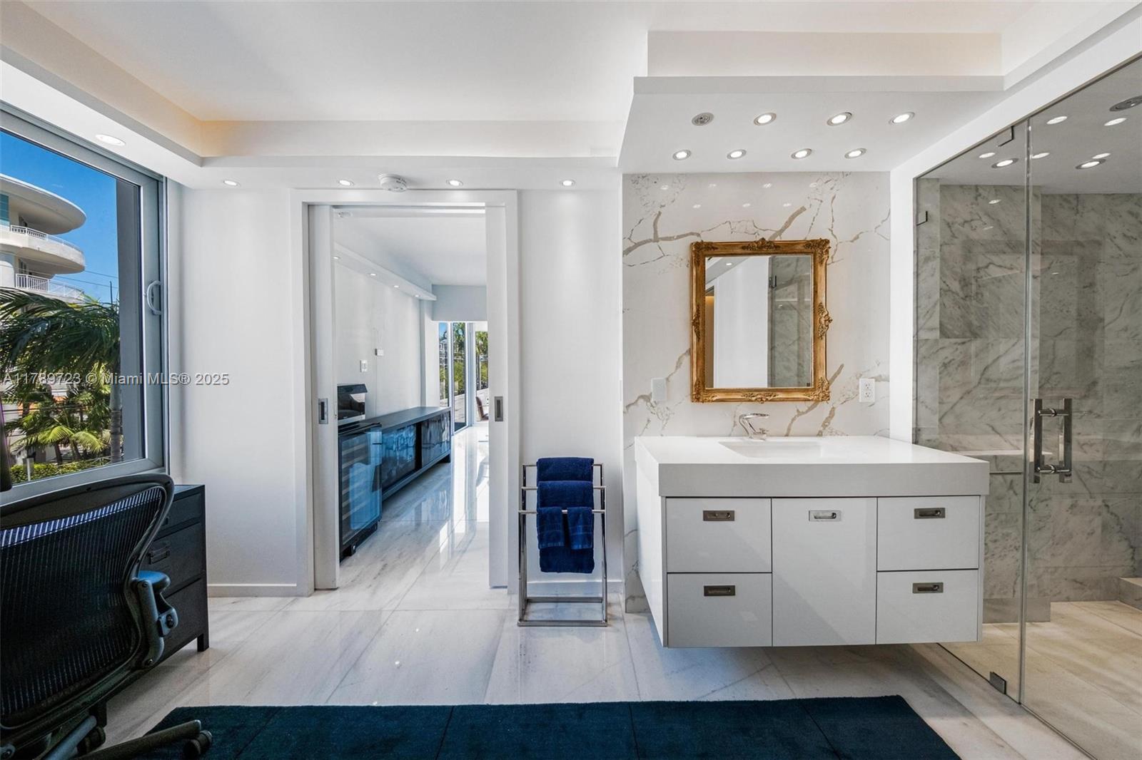 3 Island Avenue, Unit 3C Miami Beach, FL 33139 - Photo 22 of 73 a spacious bathroom with a double vanity sink and a mirror