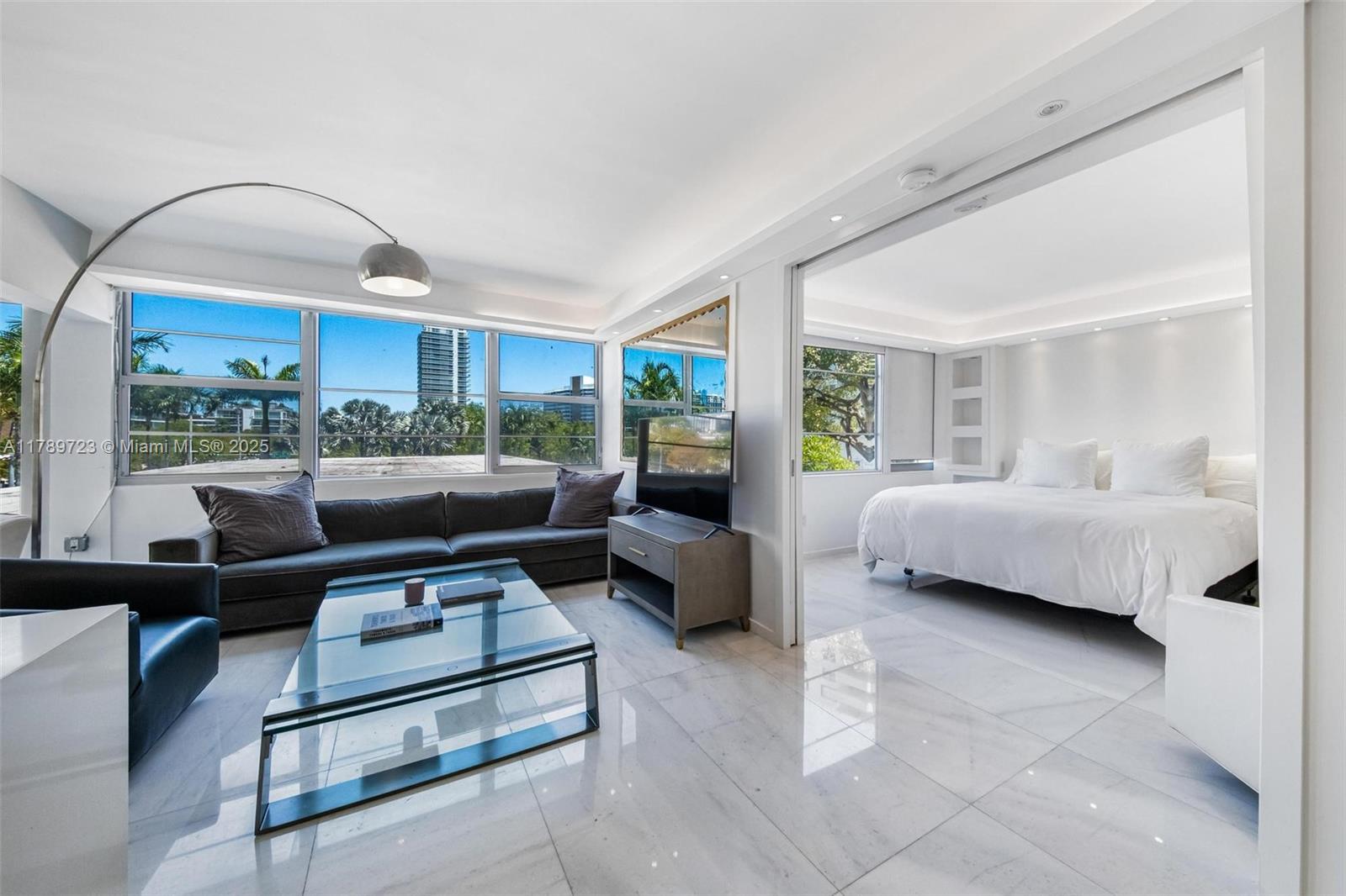3 Island Avenue, Unit 3C Miami Beach, FL 33139 - Photo 30 of 73 a living room with furniture and a large window