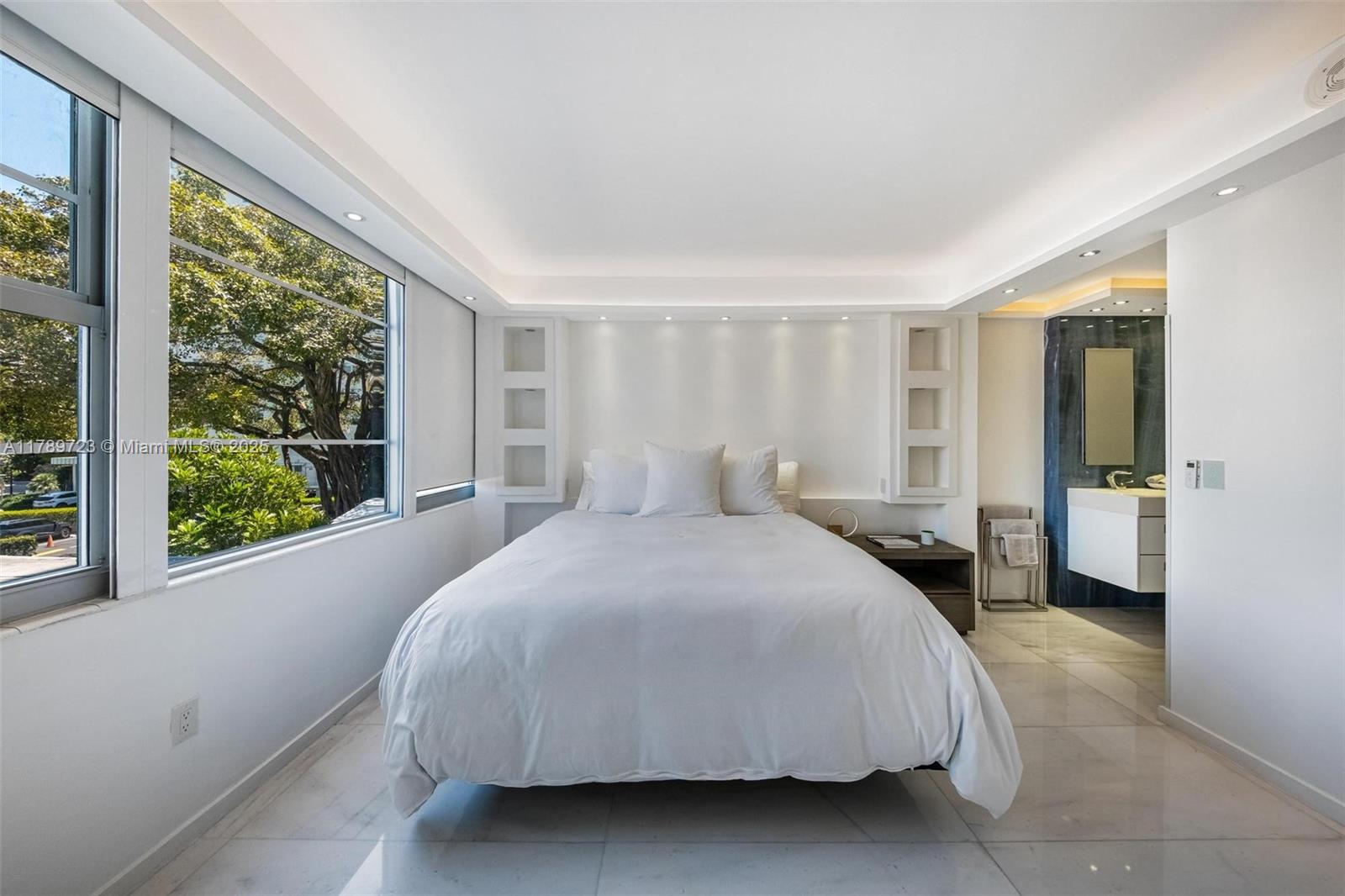 3 Island Avenue, Unit 3C Miami Beach, FL 33139 - Photo 33 of 73 a spacious bedroom with a bed and a large window