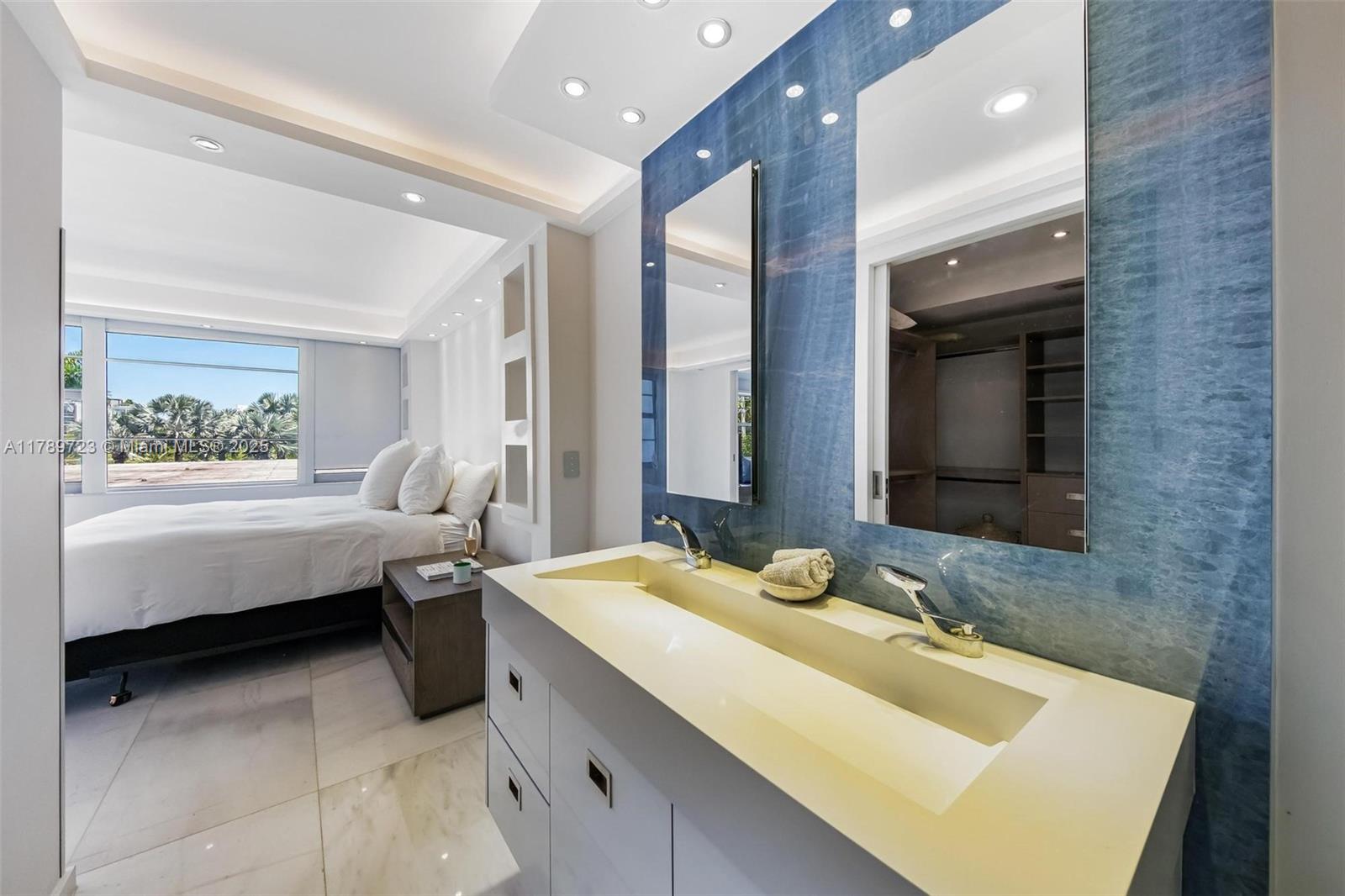 3 Island Avenue, Unit 3C Miami Beach, FL 33139 - Photo 39 of 73 a bathroom with a double vanity sink mirror and bathtub