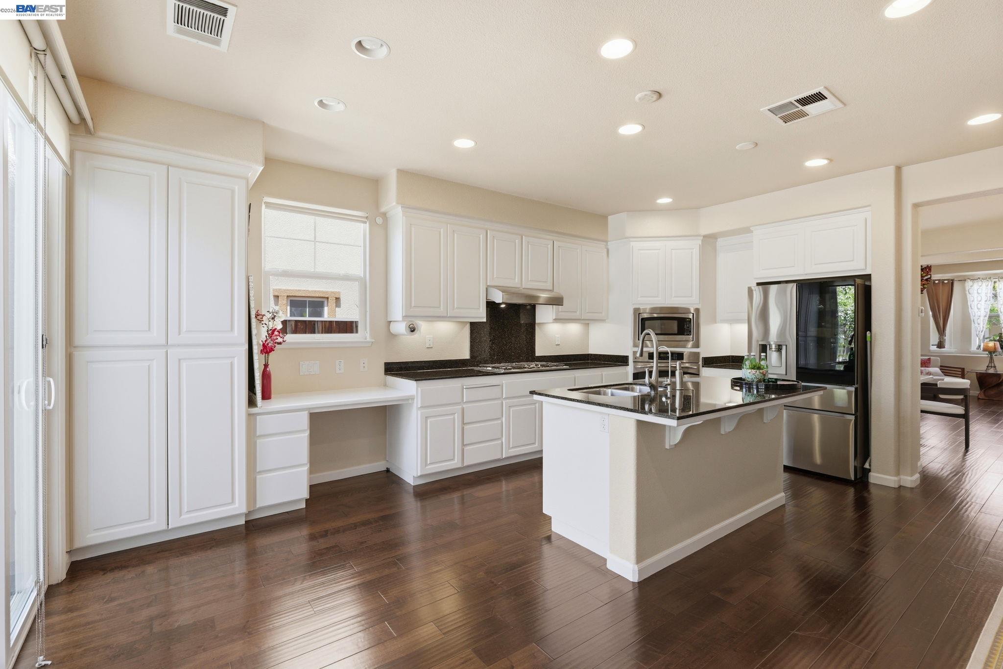 5029 Queensbury Way San Ramon, CA 94582 - Photo 10 of 58 a kitchen with stainless steel appliances a refrigerator a stove top oven and sink
