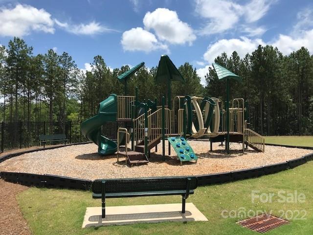 18821 Bankhead Road, Unit 303 Charlotte, NC 28278 - Photo 6 of 6 a view of a swimming pool with a table and chairs