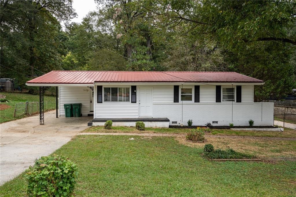 721 Conley Road Forest Park, GA 30297 - Photo 1 of 1 a house with swimming pool in front of it