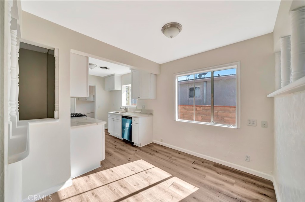 38453 3rd Street East Palmdale, CA 93550 - Photo 11 of 38 a room with kitchen island a sink and a stove top oven