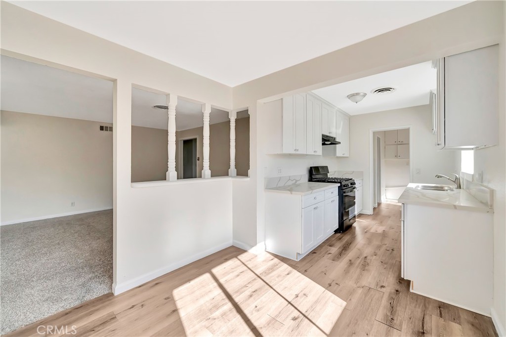 38453 3rd Street East Palmdale, CA 93550 - Photo 13 of 38 a kitchen with stainless steel appliances granite countertop a refrigerator and a sink