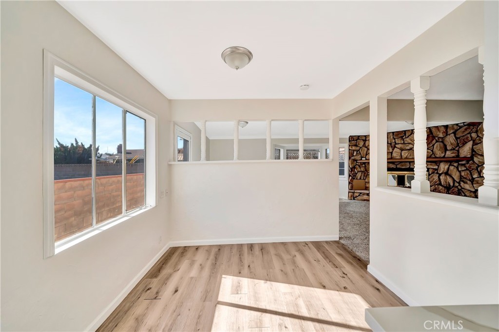 38453 3rd Street East Palmdale, CA 93550 - Photo 16 of 38 hallway view with wooden floor and windows