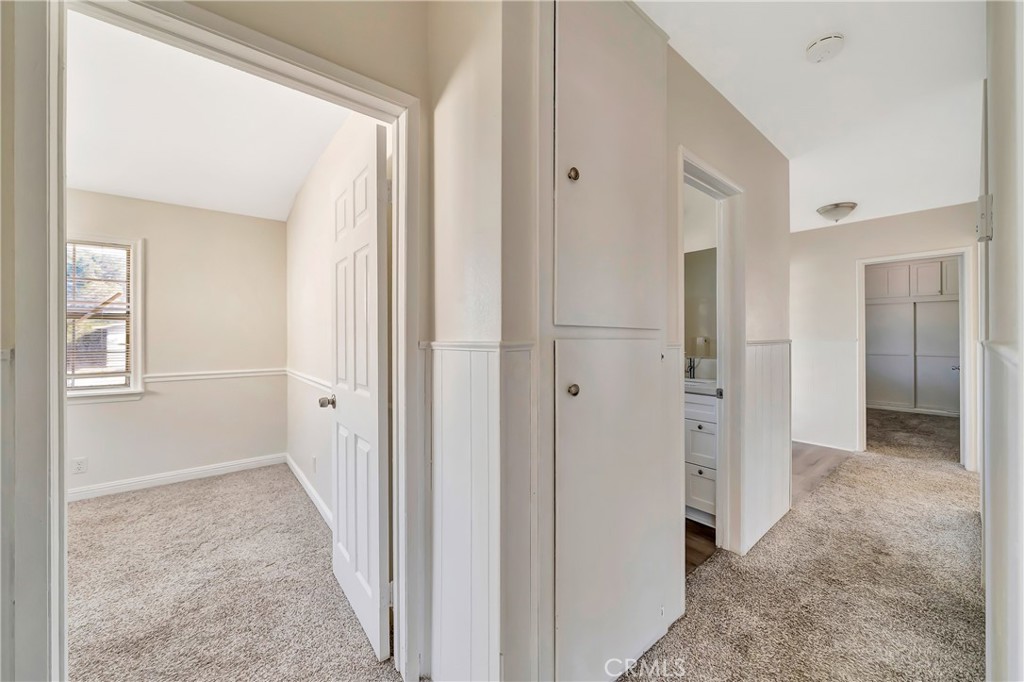 38453 3rd Street East Palmdale, CA 93550 - Photo 18 of 38 a view of a hallway with closet and bathroom