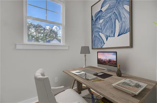 a dining room with a table and chairs