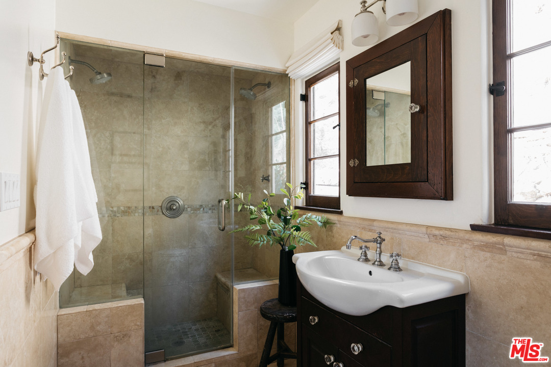 8515 Ridpath Drive Los Angeles, CA 90046 - Photo 16 of 20 a bathroom with a sink toilet and shower