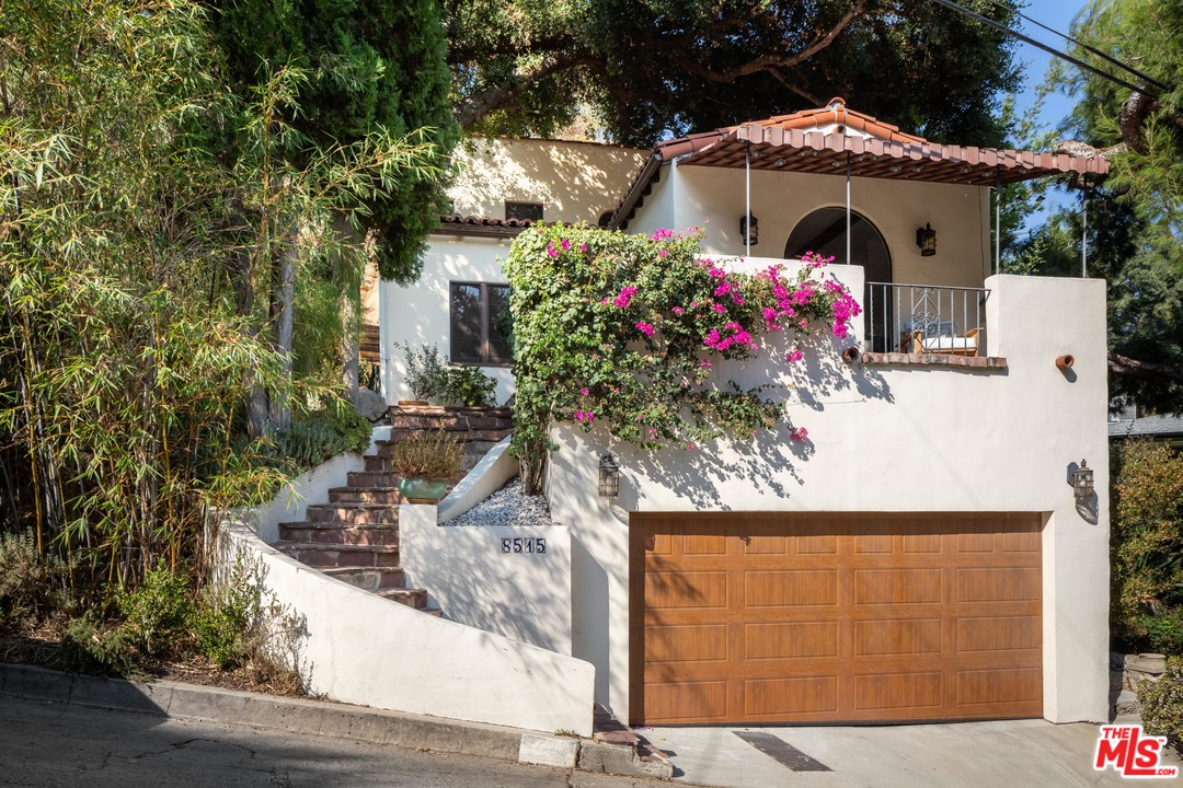 8515 Ridpath Drive Los Angeles, CA 90046 - Photo 20 of 20 a front view of a house with an outdoor space