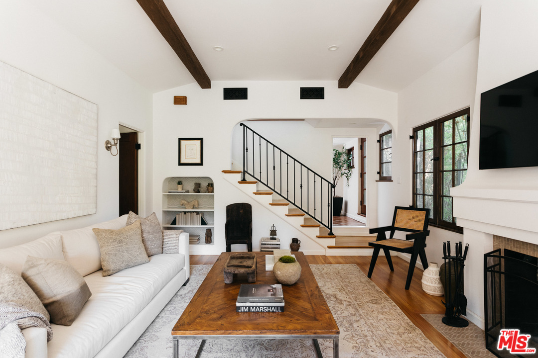 8515 Ridpath Drive Los Angeles, CA 90046 - Photo 5 of 20 a living room with furniture and a fireplace