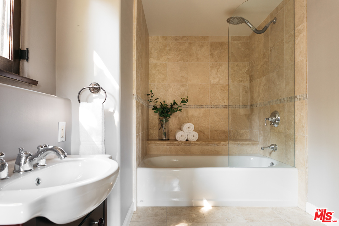 8515 Ridpath Drive Los Angeles, CA 90046 - Photo 9 of 20 a bathroom with a bathtub and a sink