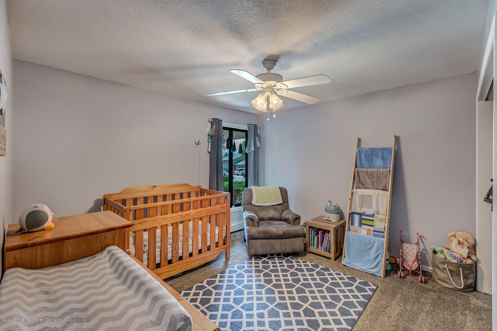 550 Aspen Avenue Rifle, CO 81650 - Photo 19 of 25 a bedroom with furniture and a window