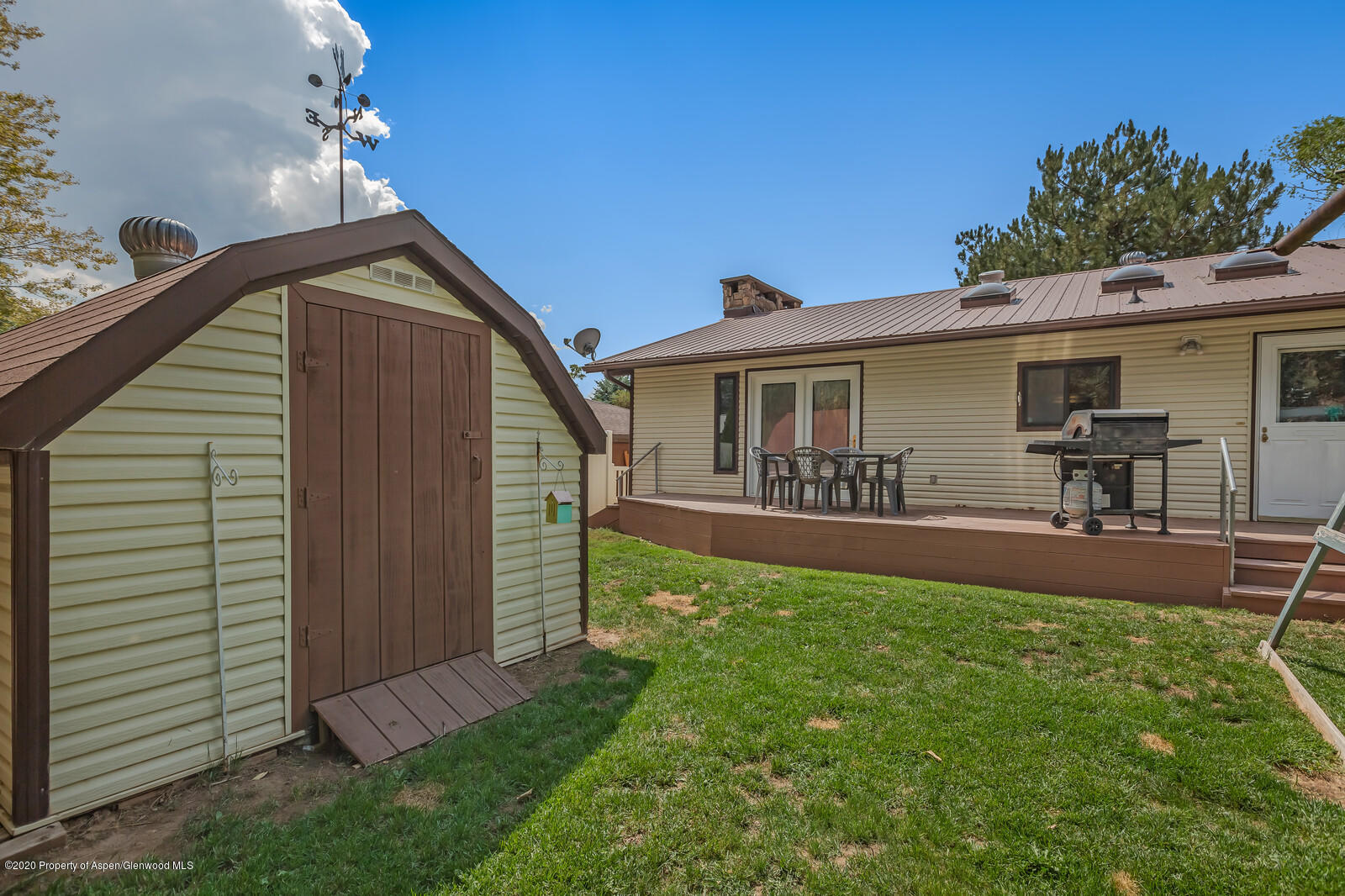 550 Aspen Avenue Rifle, CO 81650 - Photo 24 of 25 a view of a house with backyard porch and sitting area