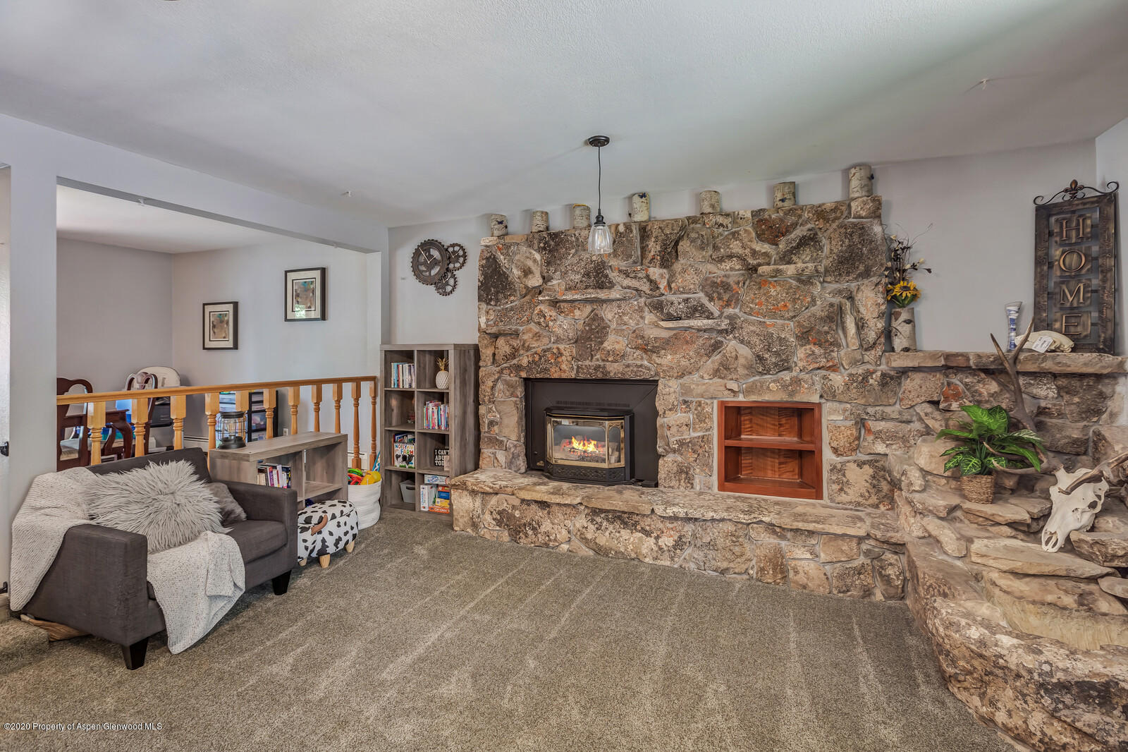 550 Aspen Avenue Rifle, CO 81650 - Photo 5 of 25 a living room with furniture and a fireplace