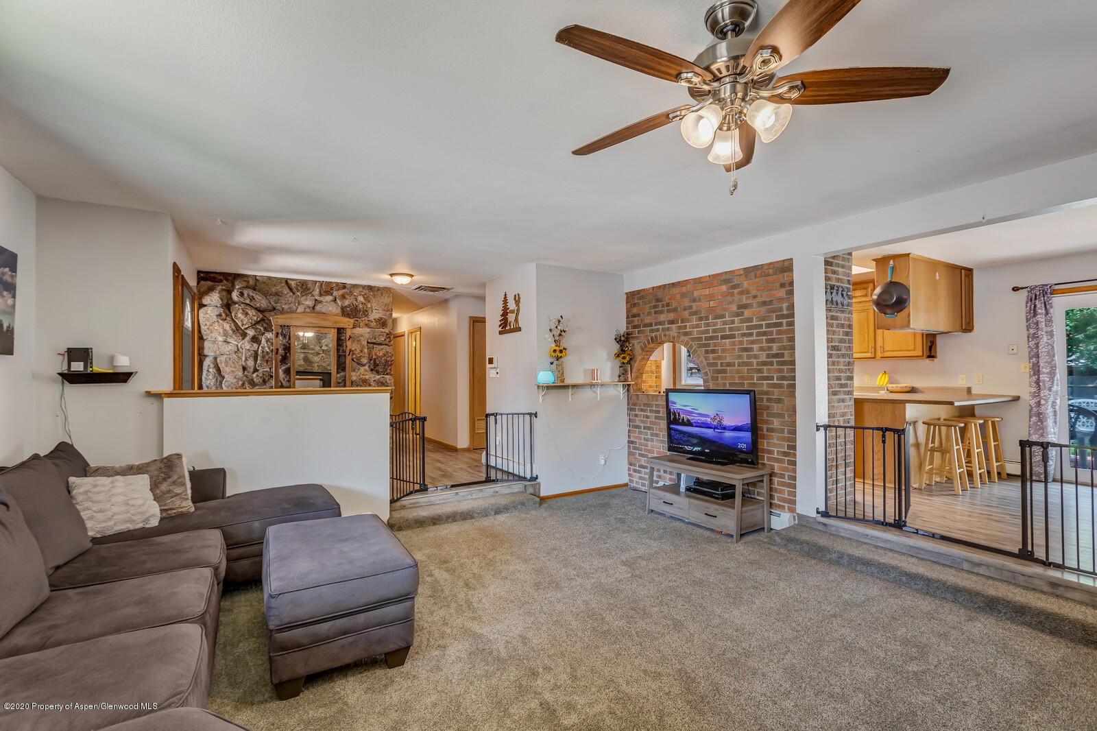 550 Aspen Avenue Rifle, CO 81650 - Photo 6 of 25 a living room with furniture and a fireplace