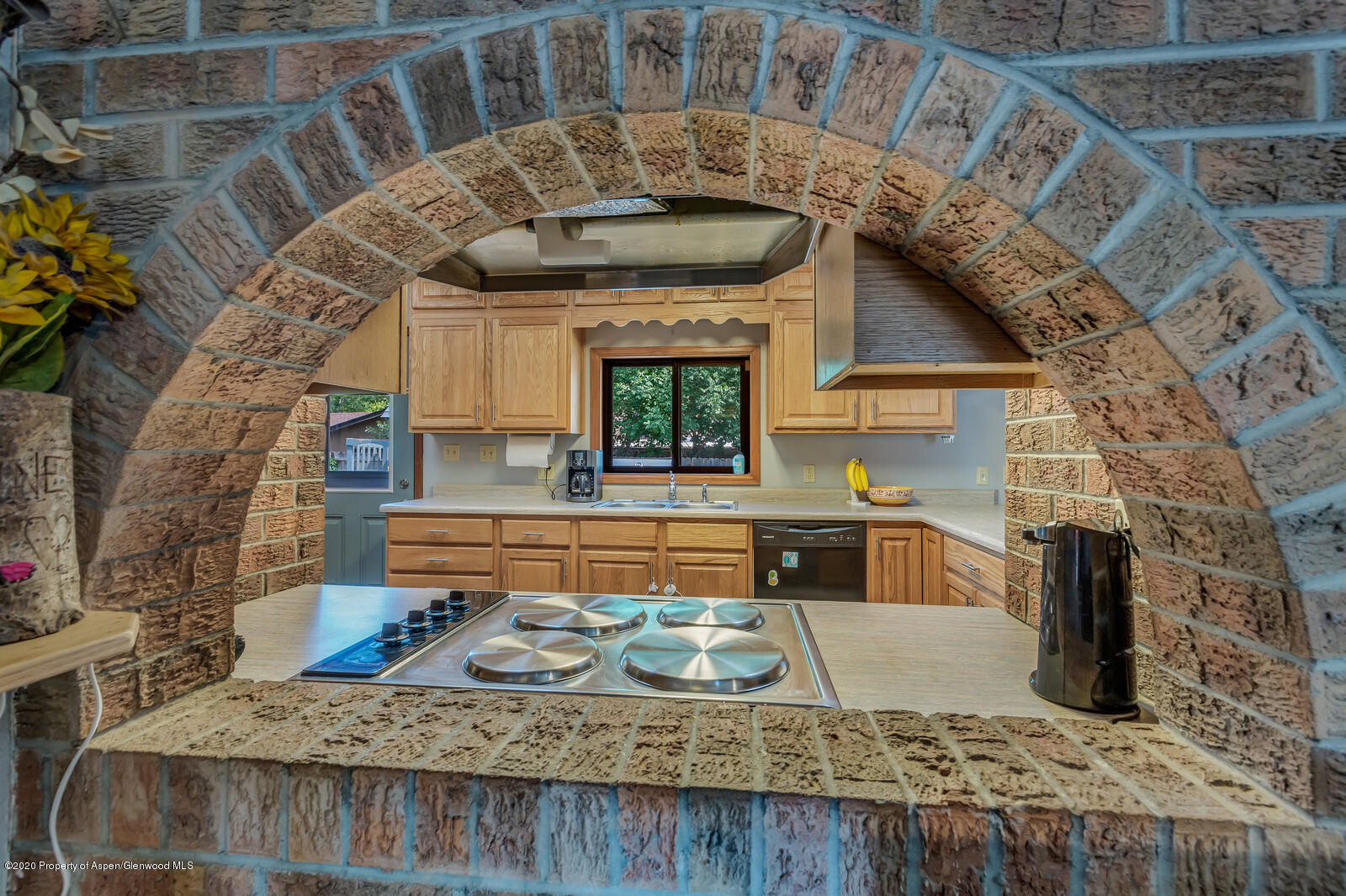 550 Aspen Avenue Rifle, CO 81650 - Photo 7 of 25 a kitchen with furniture and a fireplace