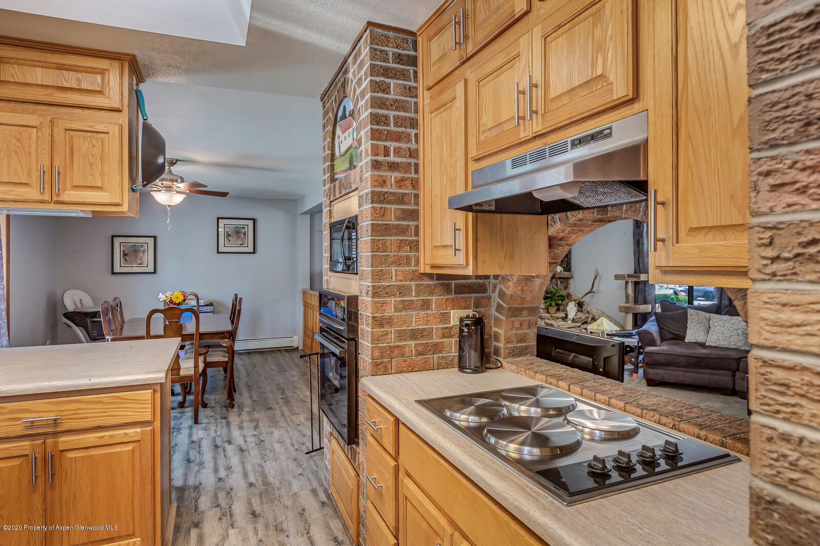 550 Aspen Avenue Rifle, CO 81650 - Photo 9 of 25 a kitchen with stainless steel appliances granite countertop a stove and a refrigerator