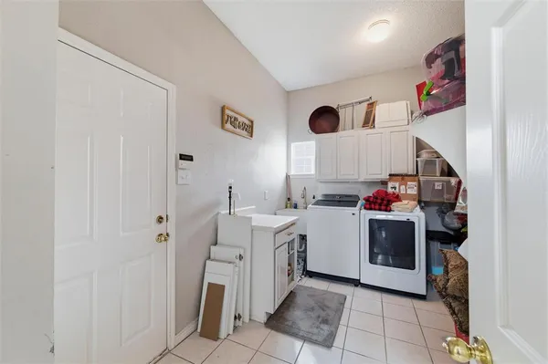 a kitchen with a sink and a stove top oven