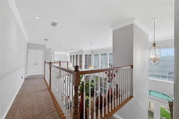 a view of a hallway with windows
