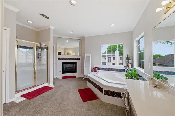 a living room with fireplace furniture and a fireplace