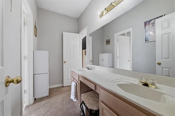 a bathroom with a sink and mirror