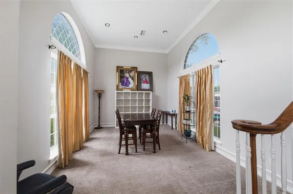 a view of a livingroom with furniture and a window