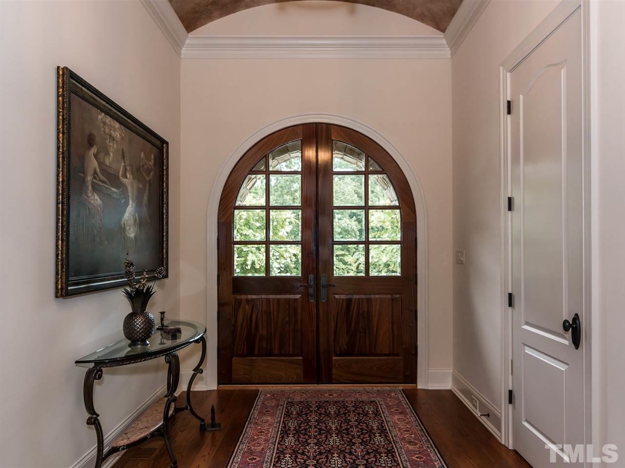 5216 Newstead Manor Lane Raleigh, NC 27606 - Photo 3 of 25 Solid mahogany doors welcome you to this lovely home. The elegant foyer sets the tone for the tour you are about to enjoy.
