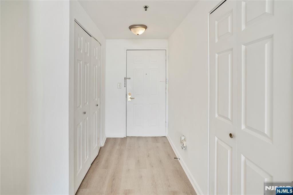 100 Old Palisade Road, Unit 2709 Fort Lee, NJ 07024 - Photo 12 of 15 a view of a hallway with wooden floor