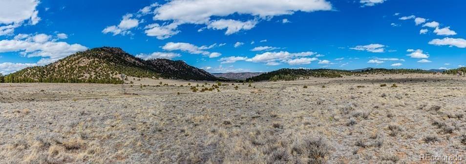 Lot 36 Marcey Road Westcliffe, CO 81252 - Photo 16 of 25 a view of a backyard of a house with a mountain