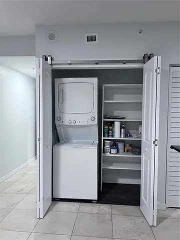 a utility room with washer and dryer