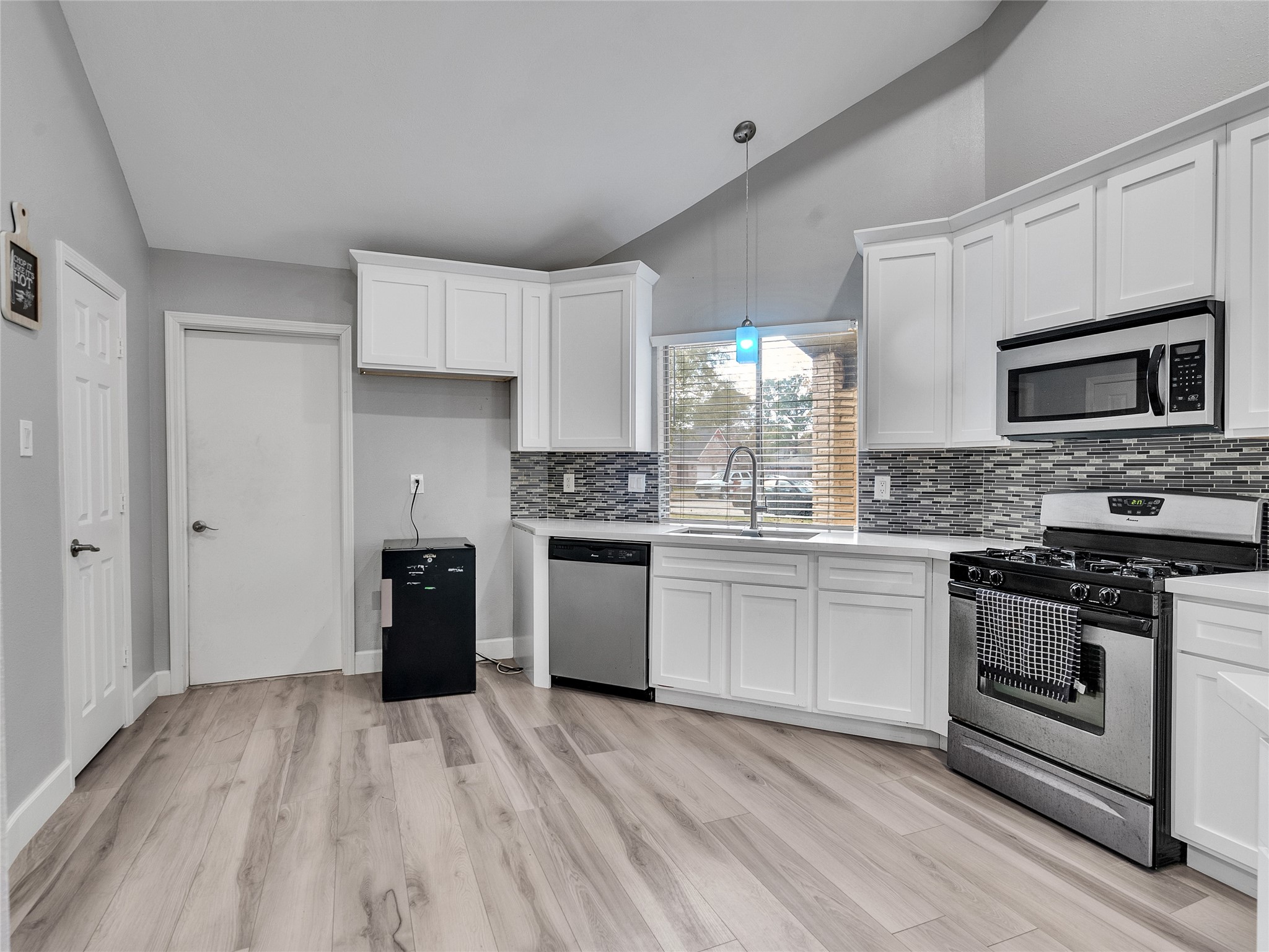 22302 Mosswillow Lane Tomball, TX 77375 - Photo 7 of 23 You'll love coming in from the garage door. straight into the kitchen as your gas range will be waiting for you to cook up that delicious meal!