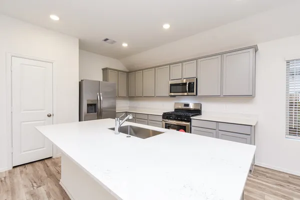 a bathroom with a sink toilet and vanity