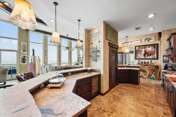 a large kitchen with a table and chairs