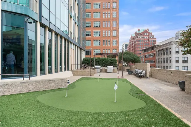 a view of a patio with a table and chairs