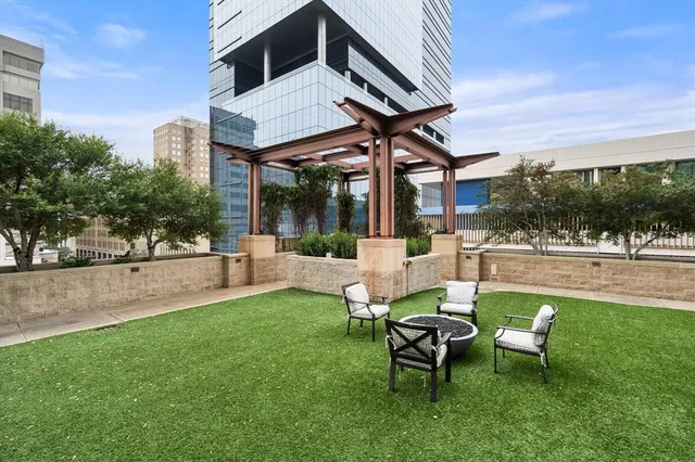 a view of a hallway with wooden floor and furniture
