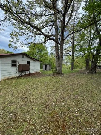 a backyard of a house with lots of green space