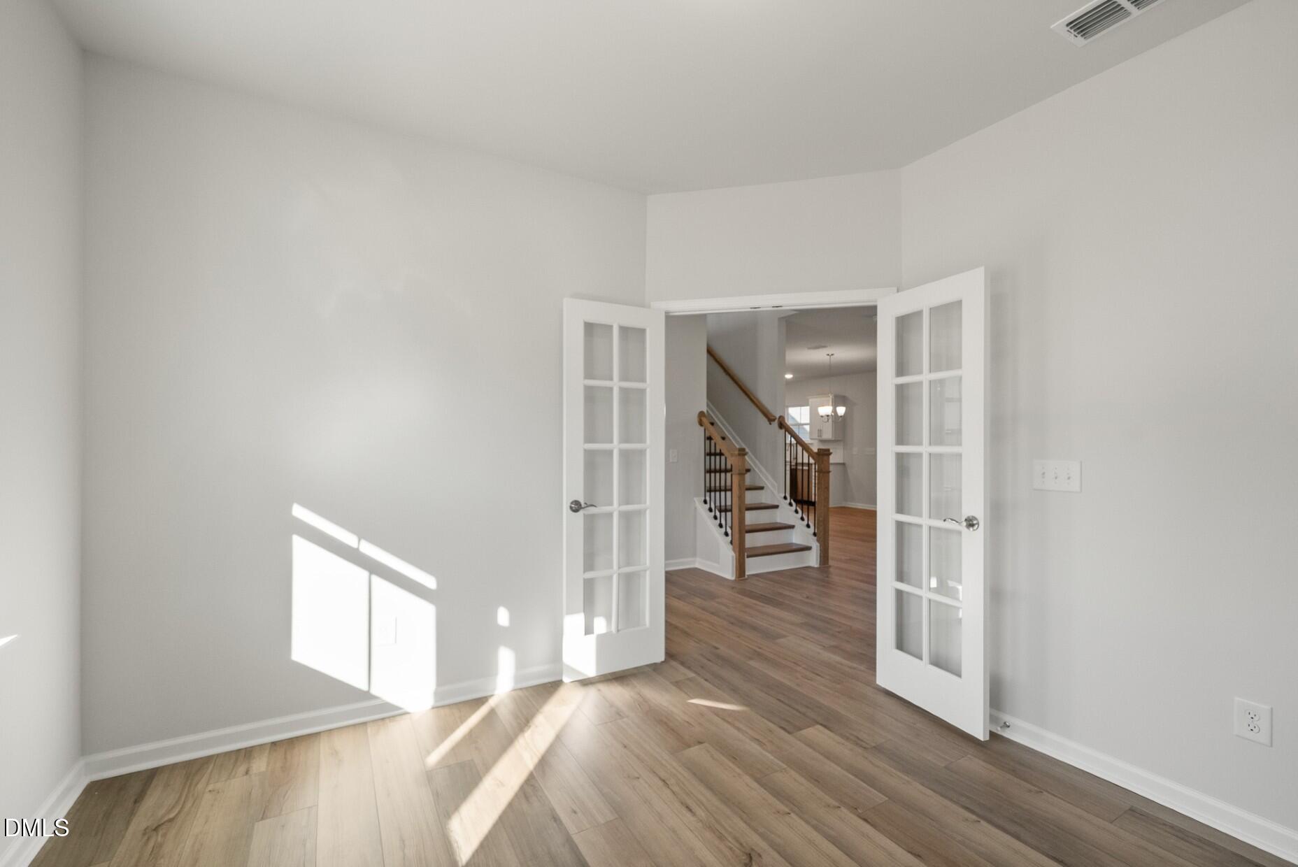 213 Bridle Brk Way Fuquay-Varina, NC 27526 - Photo 10 of 25 a view of entryway and hall with wooden floor