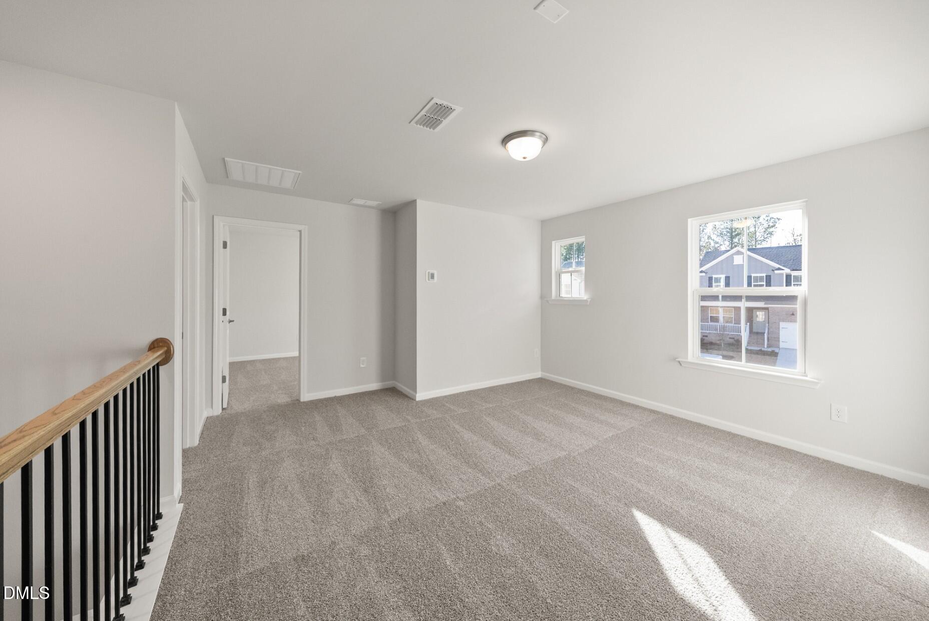 213 Bridle Brk Way Fuquay-Varina, NC 27526 - Photo 16 of 25 a view of an empty room with a window