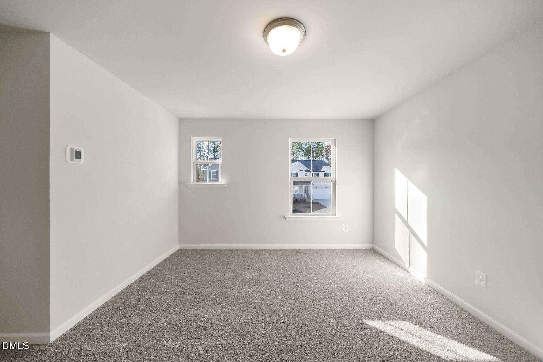 213 Bridle Brk Way Fuquay-Varina, NC 27526 - Photo 17 of 25 an empty room with windows